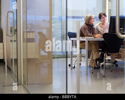 Business women looking at computer Stock Photo
