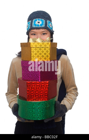 Young woman holding gift boxes Stock Photo