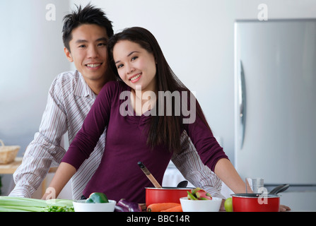 Couple together in the kitchen Stock Photo