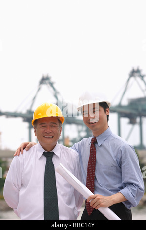 Men with helmets looking at camera Stock Photo