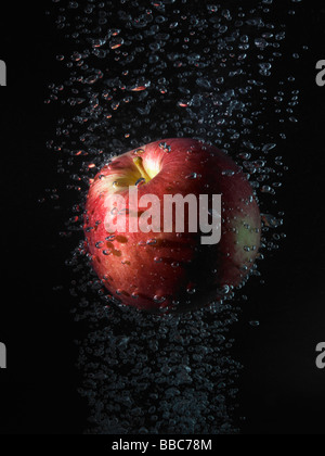 Apple in bubbles, black background Stock Photo