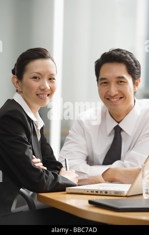 Executives smiling at camera Stock Photo