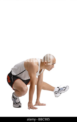 Young man doing stretching exercise Stock Photo