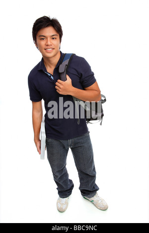 Young man carrying books and a backpack Stock Photo