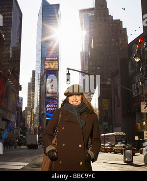 Woman standing in Times Square New York Stock Photo