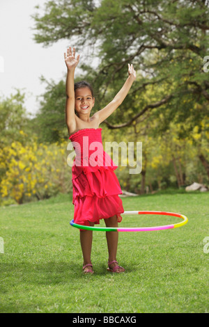 little girl with hula hoop Stock Photo