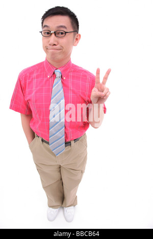 Man making peace sign, smiling at camera Stock Photo