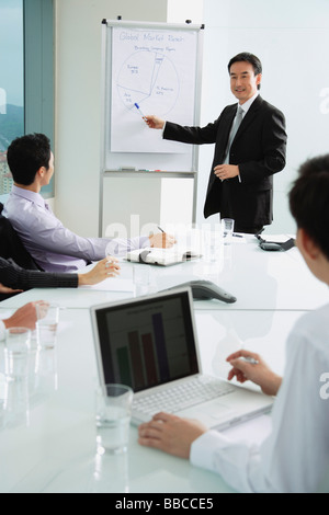 Businessman giving presentation Stock Photo