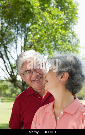 Mature couple, looking at each other, smiling Stock Photo