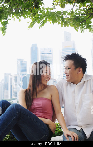 Young couple sitting and looking at each other Stock Photo