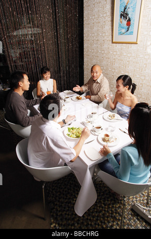 http://l450v.alamy.com/450v/bbchrg/group-of-friends-having-dinner-at-restaurant-bbchrg.jpg