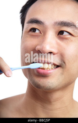Man brushing teeth Stock Photo