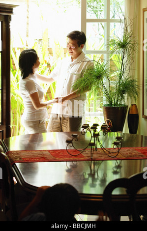 Couple standing, looking at each other Stock Photo