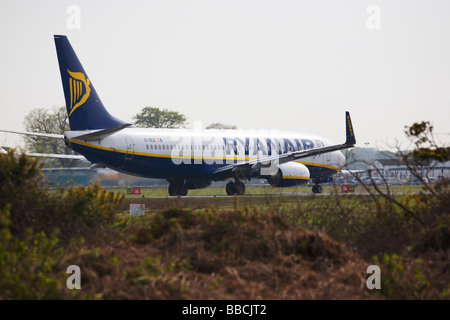 Ryanair aircraft, a Boeing 737-8AS, lining up on the runway, ready for take off at Bournemouth Airport. Dorset. UK. Stock Photo