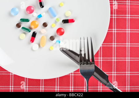 Various pills on a plate Stock Photo
