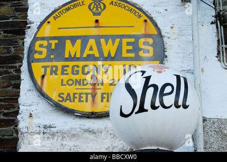 Old petrol pump and AA sign in St Mawes, Cornwall, UK Stock Photo