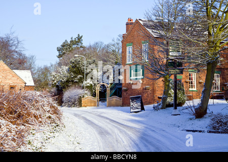 Snow covered country lane after heavy snow fall winter Park Gate Inn Cannock Wood Cannock Chase Stock Photo