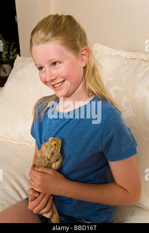 Young girl 9-11 year old holding Bearded Dragon white background MR  © Myrleen Pearson Stock Photo