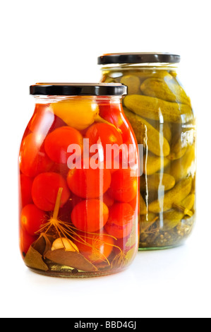 Two clear glass jars of colorful pickled vegetables Stock Photo