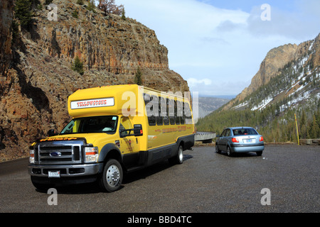 Yellowstone Buffalo Tour Bus on the road in Yellowstone National Park USA Stock Photo