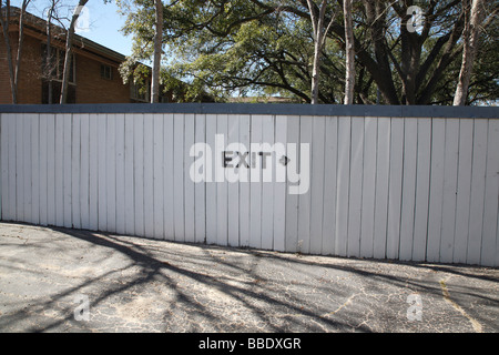 Exit Sign Painted on Fence Stock Photo