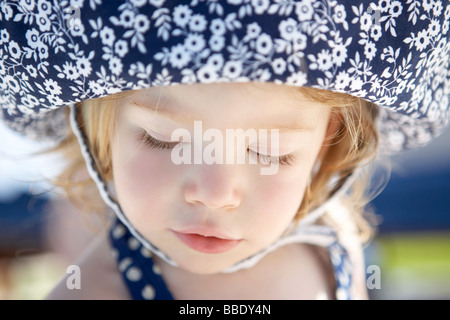 Close-up Portrait of Girl Wearing Sunhat Stock Photo