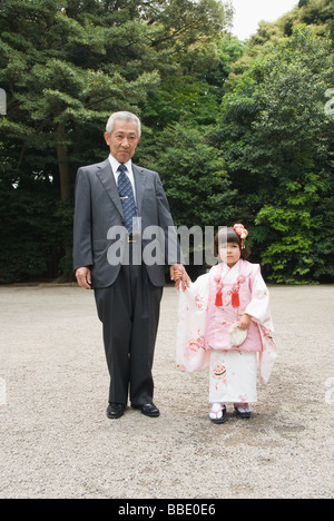 Grandfather with granddaughter wearing kimono Stock Photo