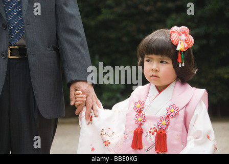 Grandfather with granddaughter wearing kimono Stock Photo