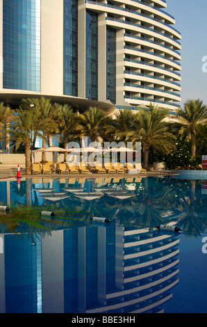 Modern architecture Meridian Hotel mirrored in the swimming pool Fujairah United Arab Emirates UAE Middle East Stock Photo