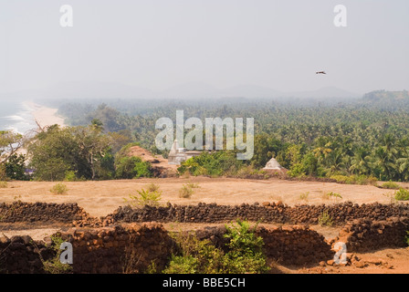 Holy city of Gokarna, view from the mountain. Temple in the center. Jungle in the background. South India. Eagle flying. Stock Photo