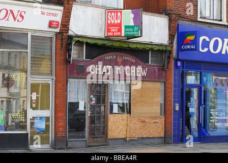 A boarded up closed restaurant with sold sign above its front door Margate Kent UK Stock Photo