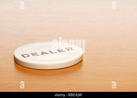 Dealer chip on desk Stock Photo