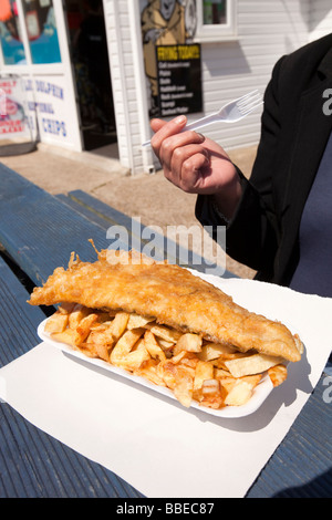 UK England Norfolk Hemsby Beach Road fish and chips takeaway food about to be eaten Stock Photo