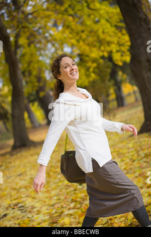 Woman Walking Through Drake Park in Autumn, Bend, Oregon, USA Stock Photo