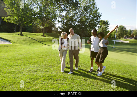 Couples on Golf Course, Burlington, Ontario, Canada Stock Photo