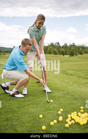 Couple Playing Golf, Burlington, Ontario, Canada Stock Photo