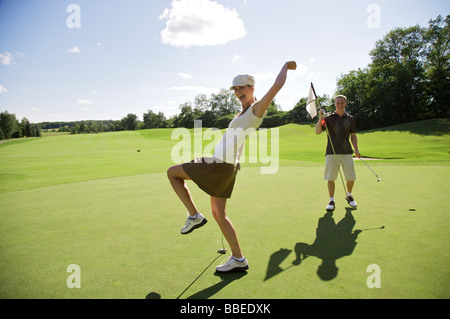 Couple Playing Golf, Burlington, Ontario, Canada Stock Photo