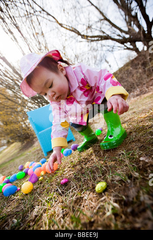 Little Girl Searching for Easter Eggs in the Park, Bethesda, Maryland, USA Stock Photo