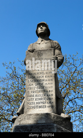 Memorial to fallen soldiers in the First World War, soldier holding a commemorative plaque, Grossenbuch, Upper Franconia, Bavar Stock Photo