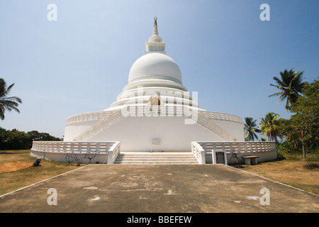 View of the Japanese built Buddhist Temple Peace Pagoda at Roomasala Hill overlooking the Galle Harbour. Stock Photo