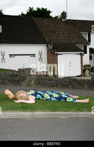 Woman Unconscious at Side of Road Stock Photo