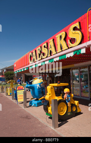 UK England Norfolk Hemsby Beach Road colourful childrens amusement arcade with rides on pavement Stock Photo