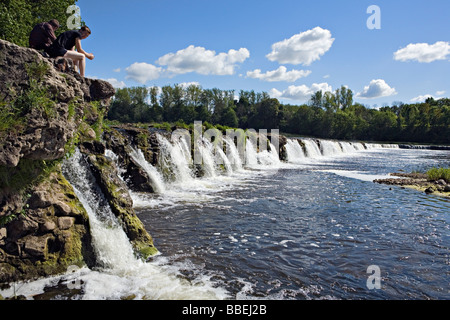 Boys at Ventas Rumba waterfalls in Kuldiga city Kurzeme Latvia Stock Photo