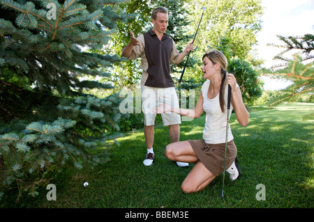 Golfers with Ball in Rough, Burlington, Ontario, Canada Stock Photo