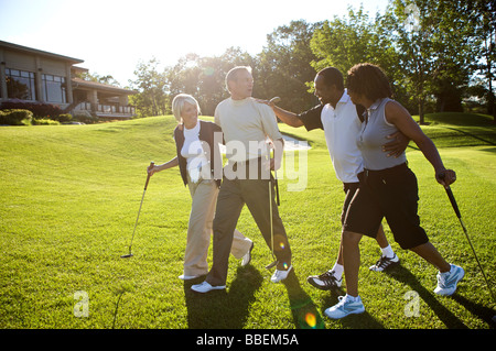 Couples on Golf Course Stock Photo