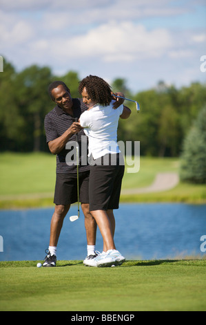 Couple Golfing Stock Photo