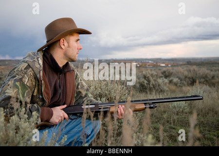 Man with Remington 12-gauge shotgun, Davenport, Washington Stock Photo