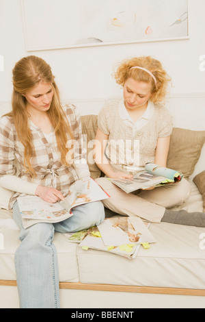 Two Women Reading Magazines Stock Photo