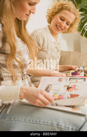 Two Women Reading Magazines Stock Photo