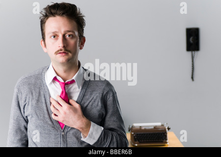 Man in Office Wearing Pink Tie Stock Photo